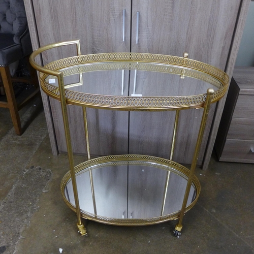 1496 - A gold mirrored drinks trolley