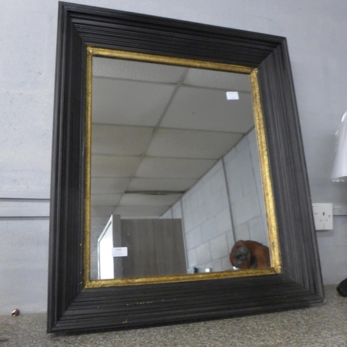 1508 - A black and gold framed mirror