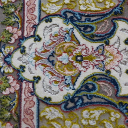 1512 - A cream ground, five woven Iranian carpet, with classical embossed floral design, 300cm x 200cm