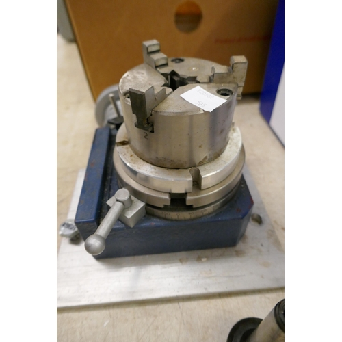 2009 - A Vertex Machinery Works rotary table complete with three-jaw chuck/vice