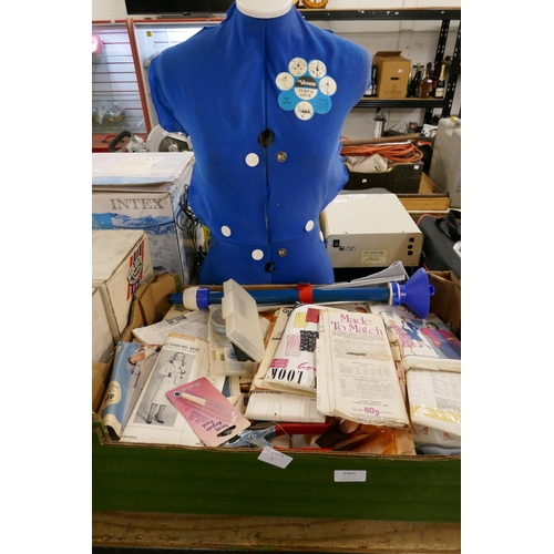 2401 - A dressmaking dummy and a large quantity of patterns