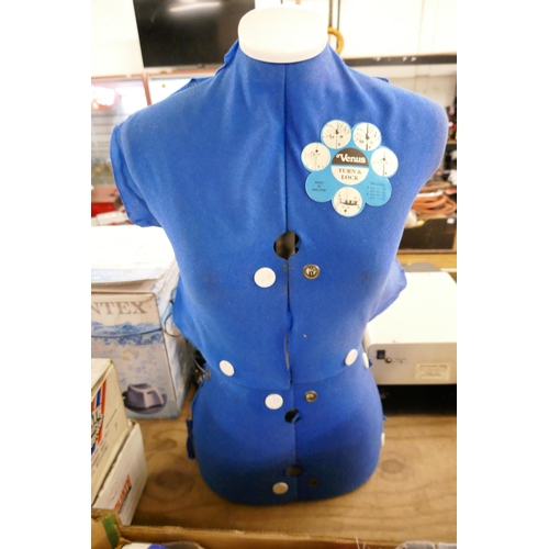 2401 - A dressmaking dummy and a large quantity of patterns