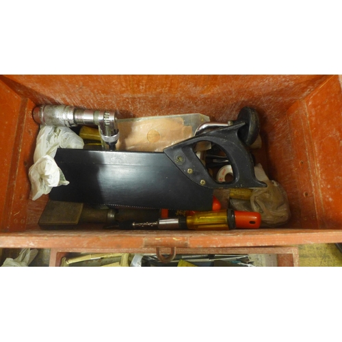 2071 - A wooden tool box of hand tools including a saw, hand drill, auger bits, screwdrivers, chisels, file... 