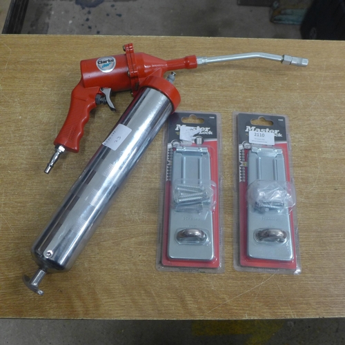 2110 - A Clarke Air (1AT125) pistol type air operated grease gun and two Master locks shed catches