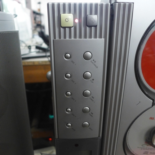 2164 - A Ministry of Sound M Series 4 disc CD player and a pair of speakers