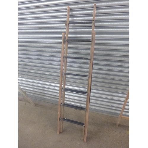 2230 - A set of 5-rung wooden stepladders, a set of 8-rung wooden stepladders and a set of wooden extension... 