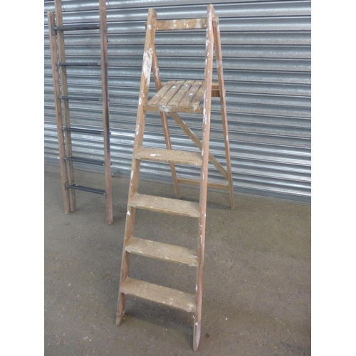 2230 - A set of 5-rung wooden stepladders, a set of 8-rung wooden stepladders and a set of wooden extension... 