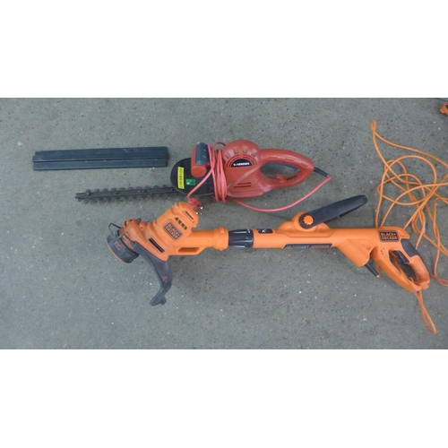 2232 - An electric Black & Decker strimmer and an electric Sovereign hedge cutter