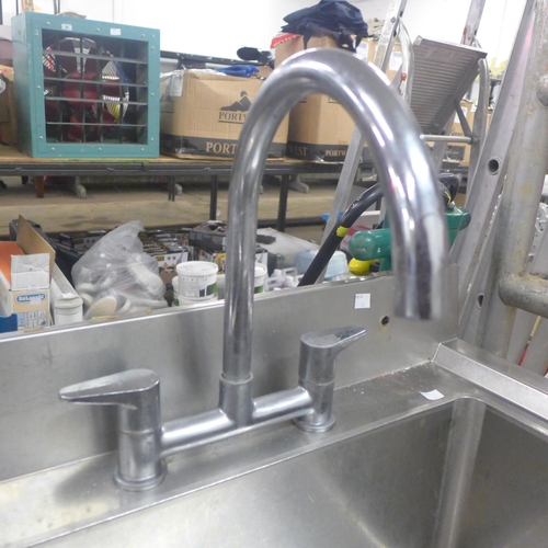 2261 - A stainless steel double sink with hose tap