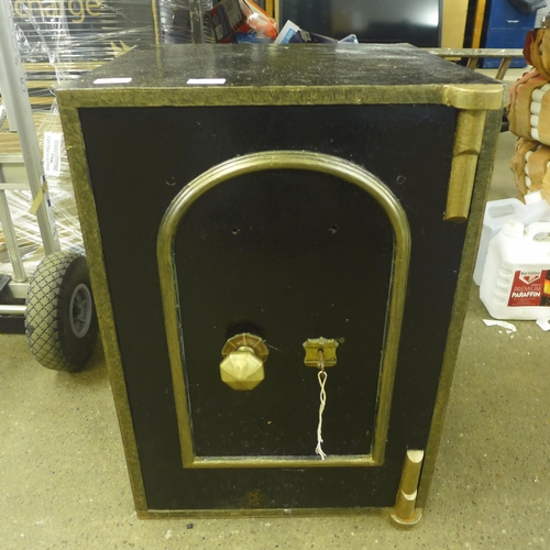 2310 - A black metal safe with key