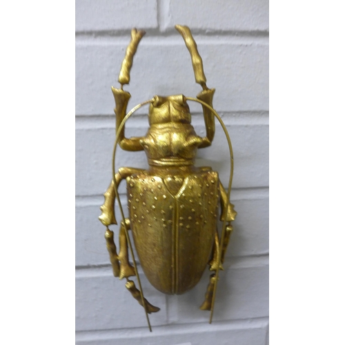 1393 - A pair of gold decorative beetles