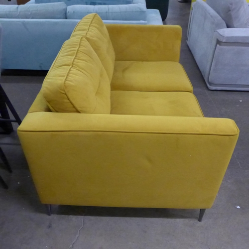 1489 - A turmeric velvet two seater sofa