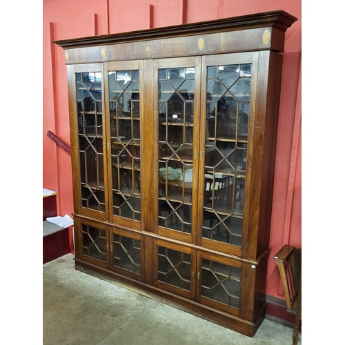 71 - A George III style inlaid mahogany astragal glazed eight door library bookcase