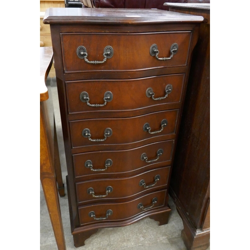 103 - A mahogany serpentine chest of drawers