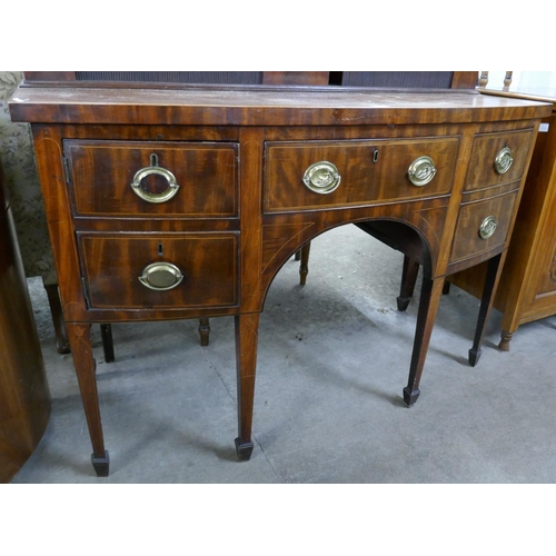 106 - A George III mahogany bow front sideboard