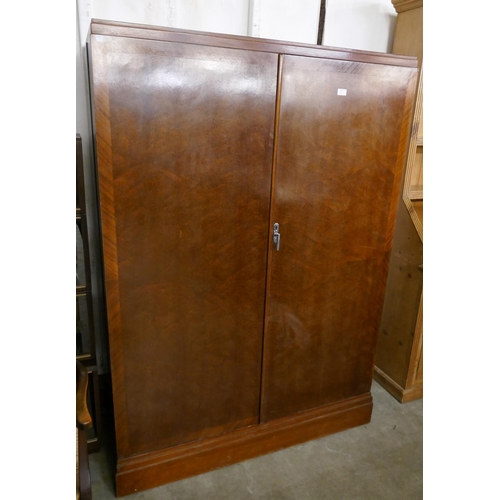 120 - An Art Deco mahogany fitted Compactum wardrobe