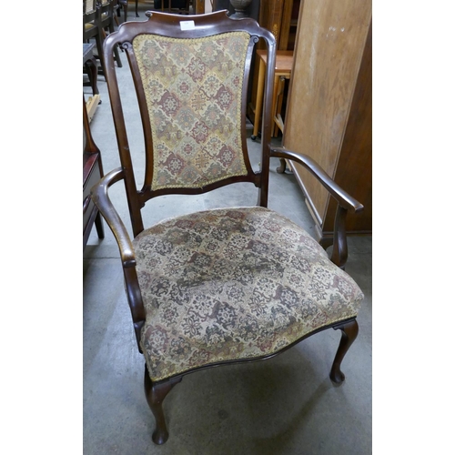 124 - An Edward VII mahogany elbow chair