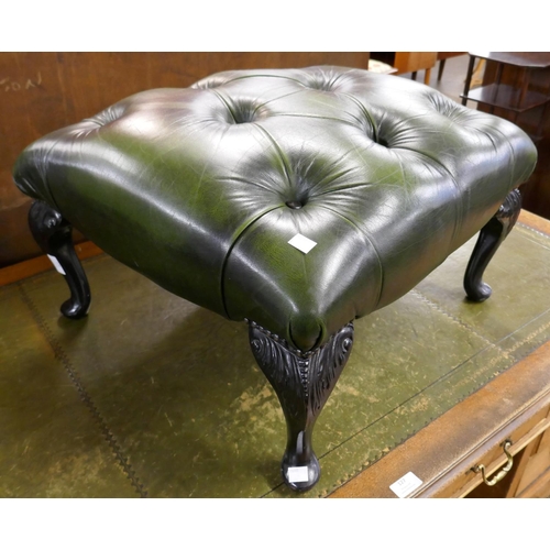 128 - A green leather Chesterfield footstool