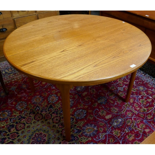 13 - A McIntosh teak circular extending table