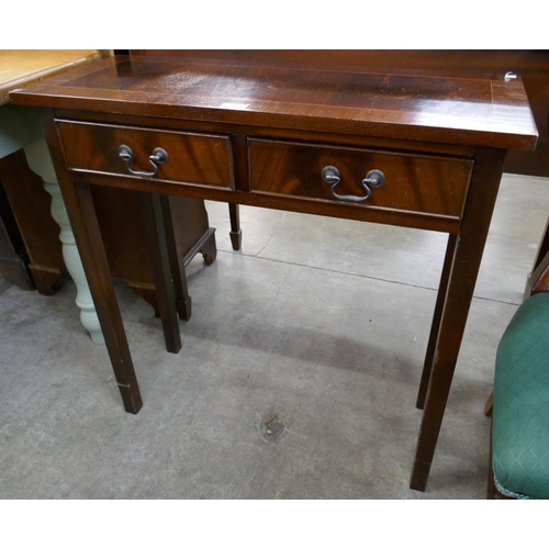 133 - A mahogany two drawer side table