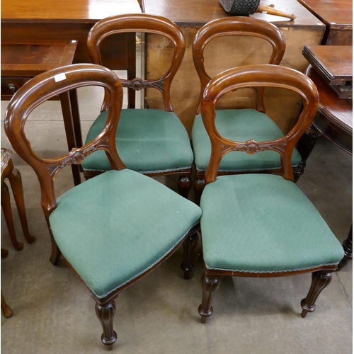 135 - A set of four Victorian mahogany balloon back dining chairs