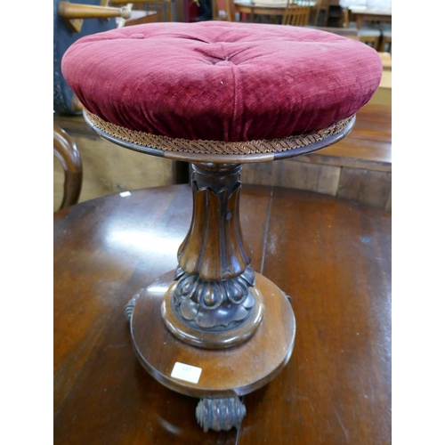 137 - A Victorian rosewood revolving piano stool