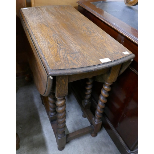 143 - An oak barleytwist gateleg table