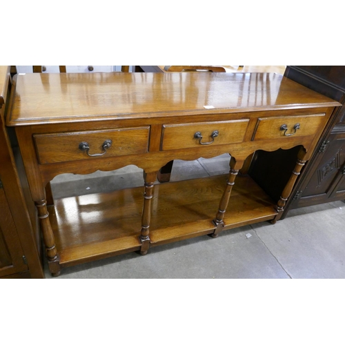 148 - A George III style oak three drawer dresser