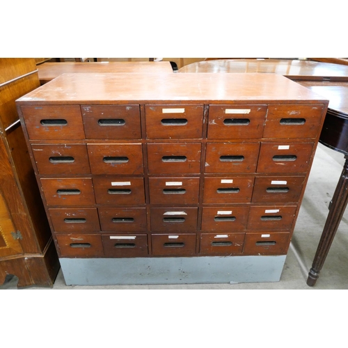 151 - A beech chest of twenty five drawers