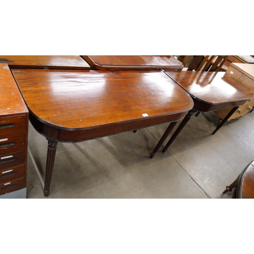 152 - A pair of Regency mahogany demi lune console tables