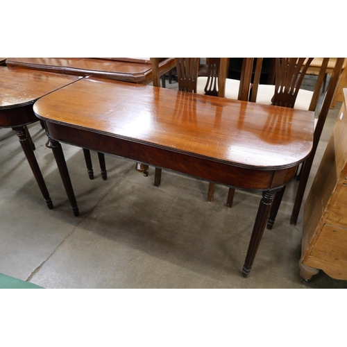 152 - A pair of Regency mahogany demi lune console tables