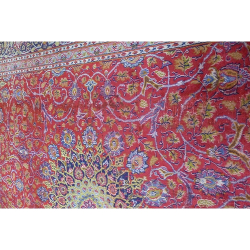 159 - A large Persian Tabriz red ground carpet, 388 x 384cms