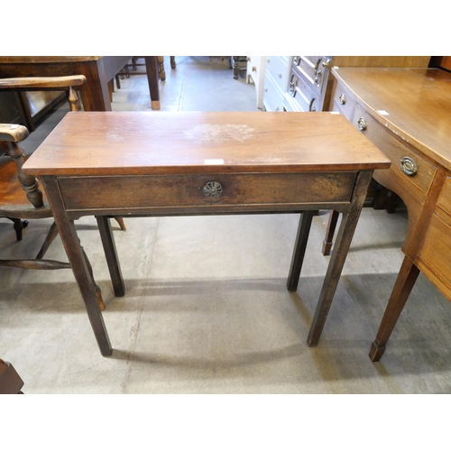 192 - A George III mahogany single drawer side table and a mahogany stool