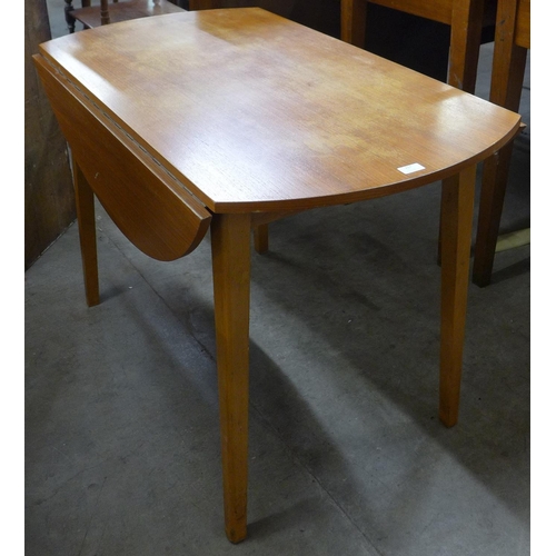 217 - A teak drop-leaf table and two pairs of chairs