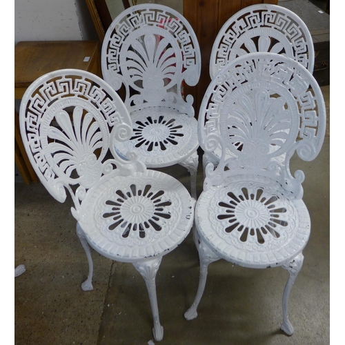 227 - A painted cast alloy garden table and four chairs