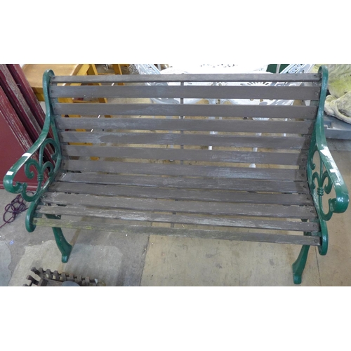 233 - A cast iron ended garden bench and chair