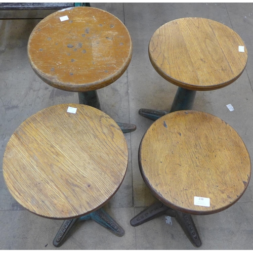 238 - A set of four cast iron based industrial factory machinists stools