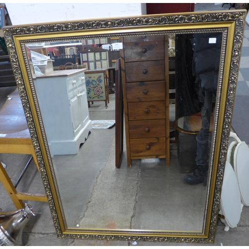 249 - A gilt framed mirror, a cream dressing table mirror and two others