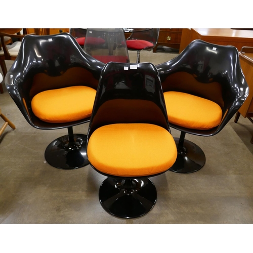 25 - A set of three Eero Saarinen style black laminate tulip chairs