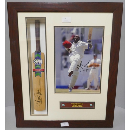 265 - A framed cricket display, photograph and miniature cricket bat, both signed by Brian Lara, West Indi... 