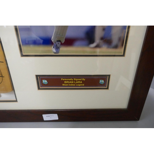 265 - A framed cricket display, photograph and miniature cricket bat, both signed by Brian Lara, West Indi... 