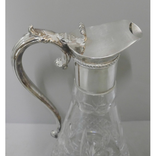 276 - A silver plated and cut crystal glass claret jug