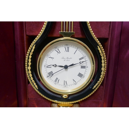 277 - A Swiss Jean Roulet Le Locle brass lyre mantel timepiece, cased