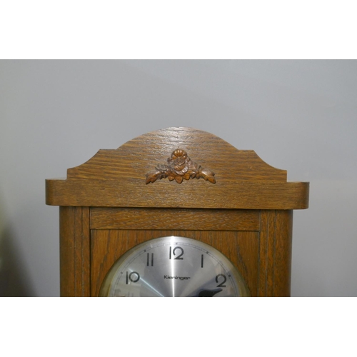 278 - A German oak wall clock and a mantel clock