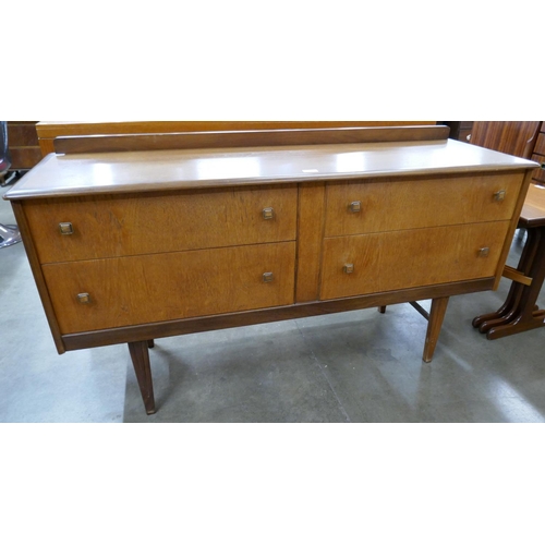 28 - A teak four drawer sideboard