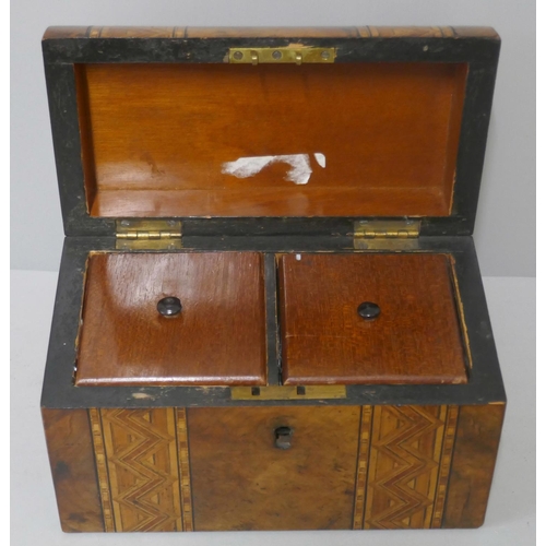 281 - A Victorian inlaid walnut domed top tea caddy