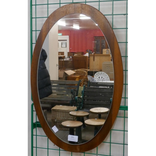 291 - A small teak oval framed mirror