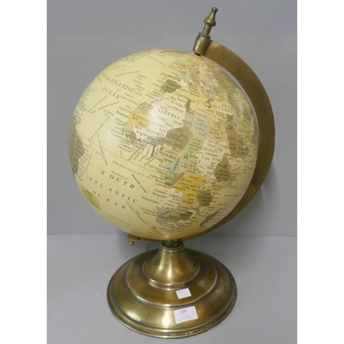 294 - A desk top terrestrial globe, on brass stand