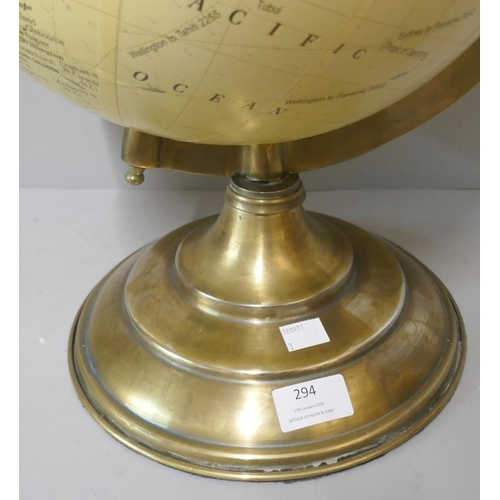 294 - A desk top terrestrial globe, on brass stand