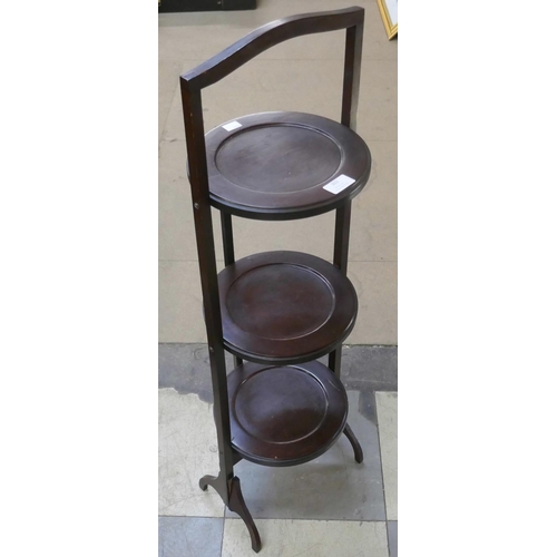 302 - A mahogany three tier folding cake stand